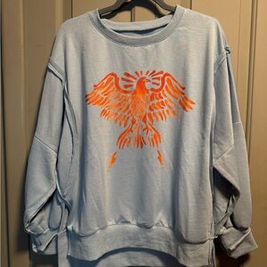 Light Blue Sweatshirt with Orange Eagle Design